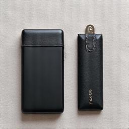 Luxury tech travel kit including a power bank and cable organizer